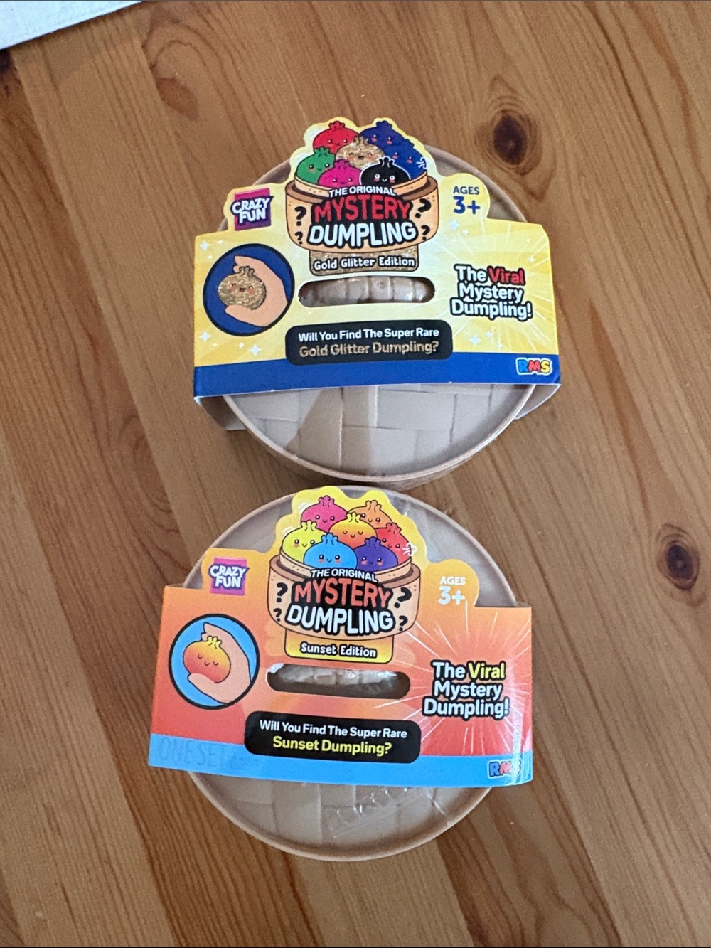 Comes with both The Original Mystery Dumpling Toy Gold Glitter & Sunset Editions
